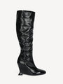 Wedge boots in crinkled patent leather