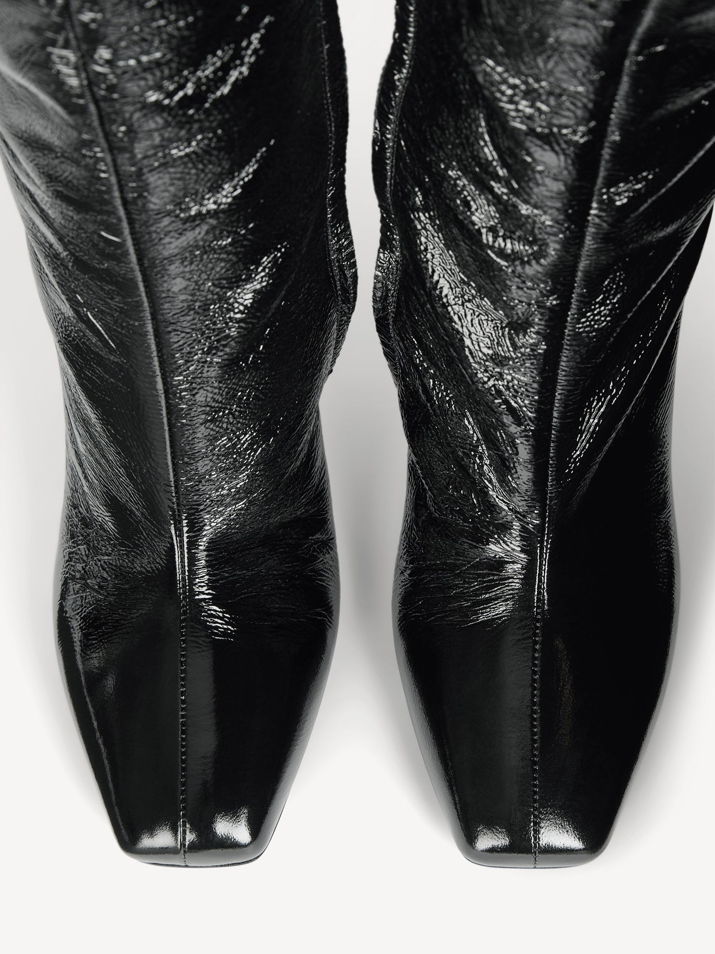 Wedge boots in crinkled patent leather