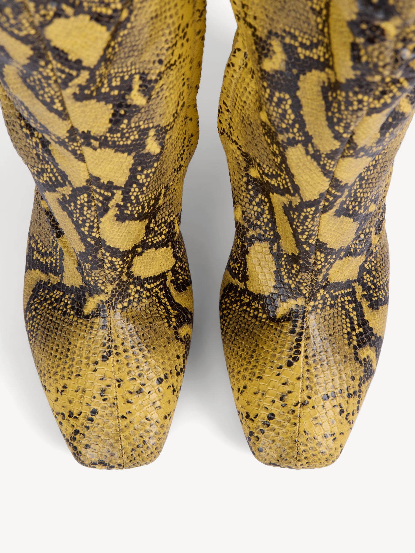 Wedge boots in python-effect leather