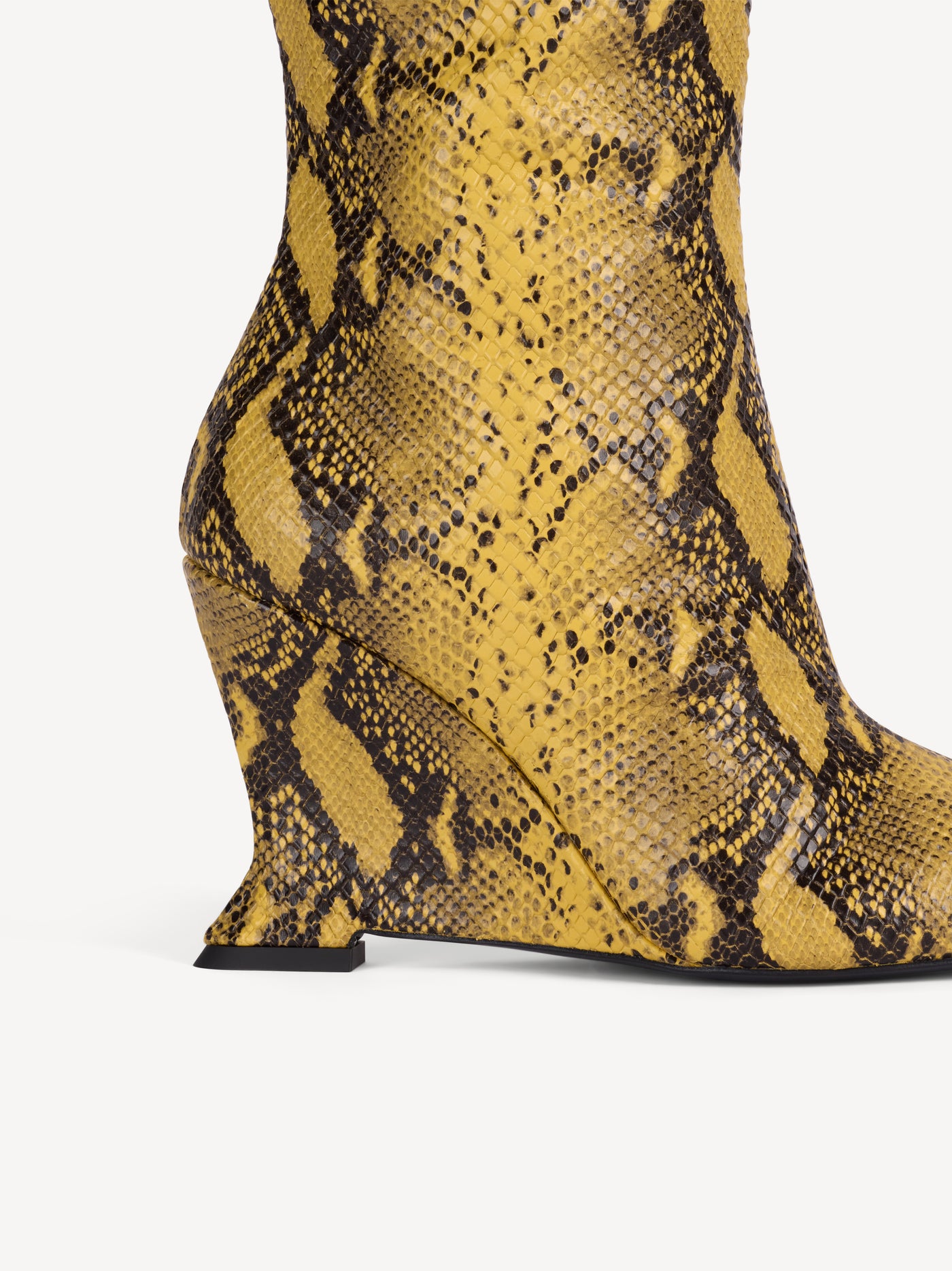 Wedge boots in python-effect leather